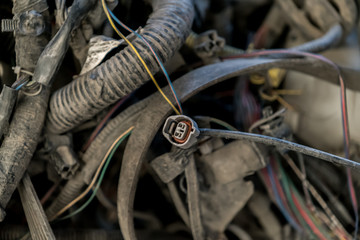 Pile of old electrical wires, dusty and non-working.
