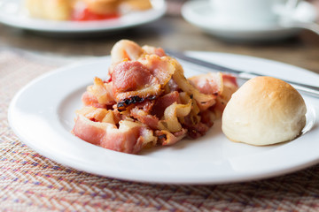 fried bacon for breakfast with bread. Homemade healthy food.