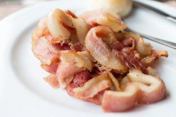fried bacon for breakfast with bread. Homemade healthy food.
