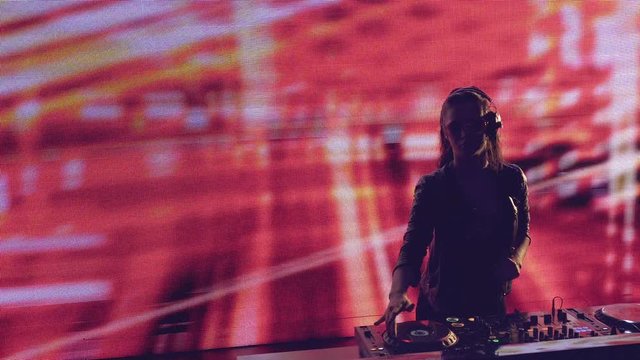 Young dj with control panel