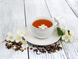 Cup of tea with jasmine flowers