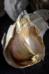 Fresh garlic on old black wood table