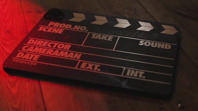 Black clapperboard movies symbol represented by an isolated film slate