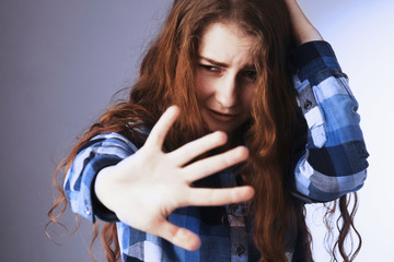 I am very afraid! Sad woman scared putting hand in front of face (Gestures, body language,...
