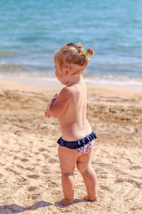 Little baby girl on beach