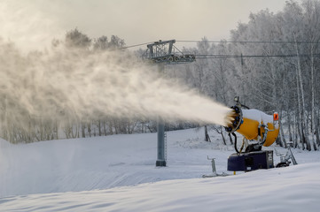 Snowcannon making snow at mountain skiing center