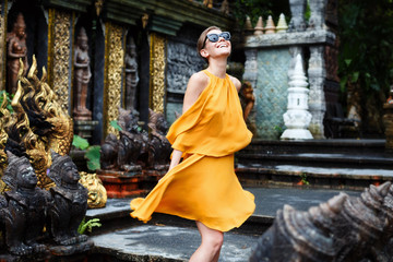 Beatiful girl is posing in a jungle temple