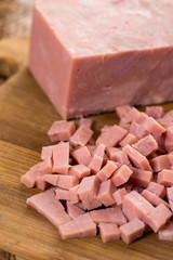 Chopped ham on the wooden board with backlight