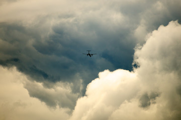 Propeller plane flying in dramatic sky