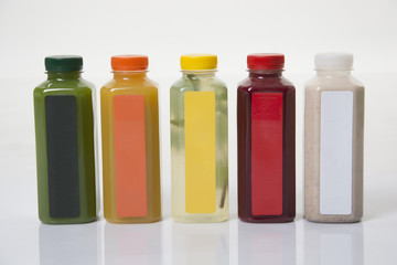 Bottles with juice on the white background