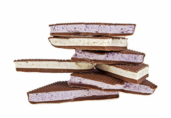 Fruit nougat in milk chocolate on a white background