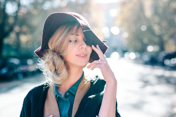 Blonde woman dreaming in hat closeaup fashion outdoors lifestyle - 144643009
