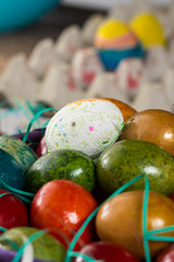 Closeup macro of colored Easter eggs in the basket