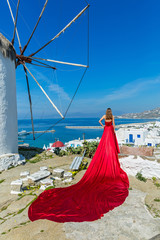 Young woman in red long dress i