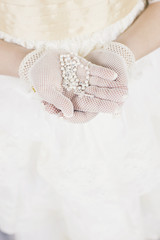 Fototapeta na wymiar First Holy Communion concept - close up on rosary on child's hands