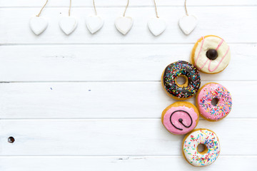 Fototapeta na wymiar Fresh donuts on white background.