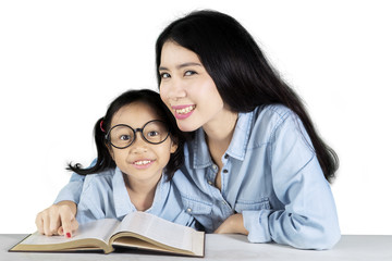 Mother and daughter studying on studio