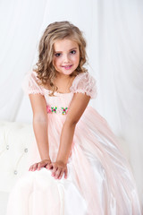 Beautiful baby girl in pink dress