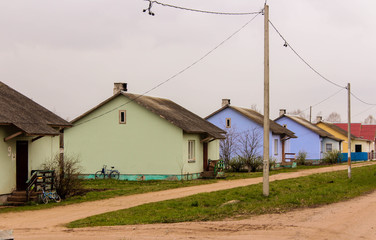 Fototapeta na wymiar Bright country houses in a row on the street