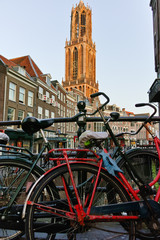 Naklejka na ściany i meble The bicycles on the bridge in Utrecht and the big tower, cityscape, the Netherlands