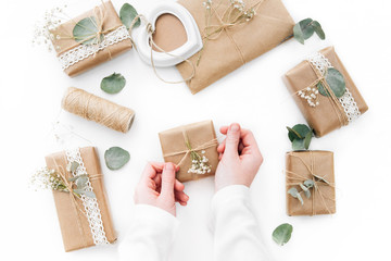 Wrapped gift boxes with flowers. Flat lay decorations 