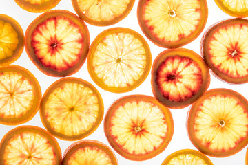 Bright red orange slices on white