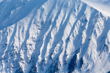 Severe mountains ridge covered by snow