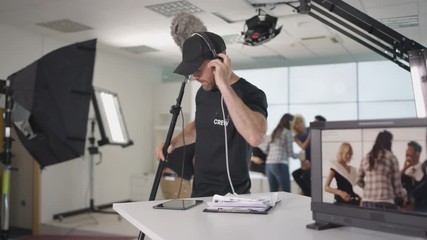  TV crew in studio, preparing to go live on air