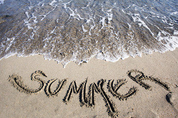 summer text written on sand