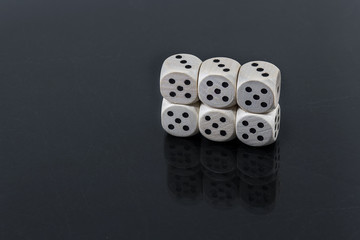 Dice six fives on a black background