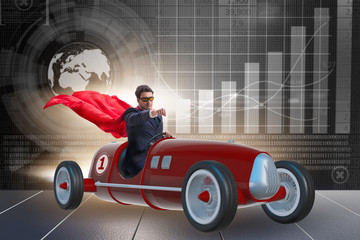 Superhero businessman driving vintage roadster