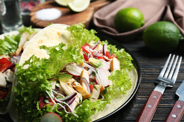 Delicious taco with tequila lime chicken on plate