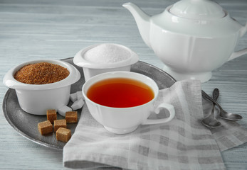 Beautiful composition with sugar on wooden table