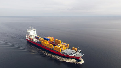 Aerial view of container vessel sailing in the sea