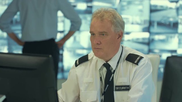  Security officer alone in observation control room singing & dancing while no-one's watching.  - Powered by Adobe