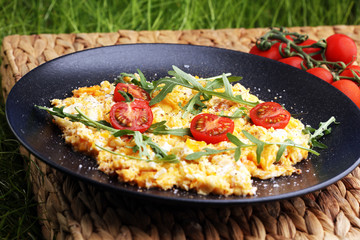 Traditional breakfast - fried eggs,ruccola, tommato- - diet concept scrambled eggs