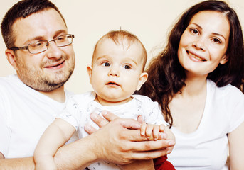young happy modern family smiling together at home. lifestyle real people concept, father holding...