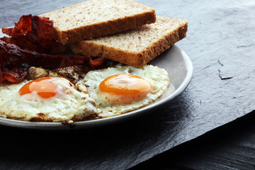 Ham and Egg. Bacon and Egg. Salted egg and sprinkled with black pepper. English breakfast.