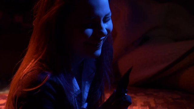 Crazy girl with a big knife. Insanity.