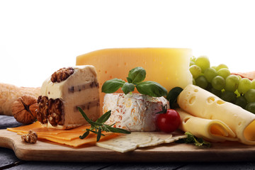 Cheese platter with different cheese and grapes