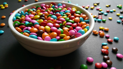 White pot with candy colored confetti