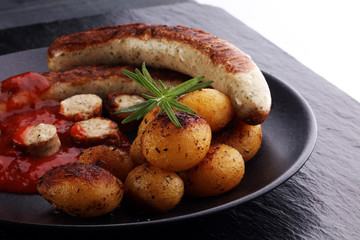 grilled sausages and potatoes
