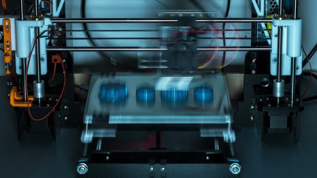 3d printer printing plastic objects gears and pulleys timelapse