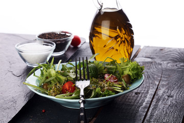 Bowl of salad on wooden table