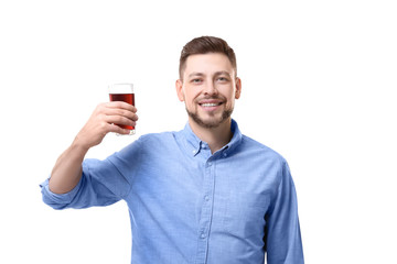 Handsome man posing with juice on white background