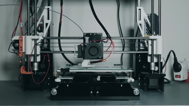 3d printer printing plastic parts gears and pulleys