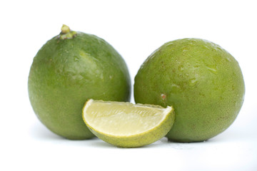 Fresh limes on white background