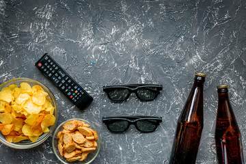 snacks for watching TV on dark background top view mock-up