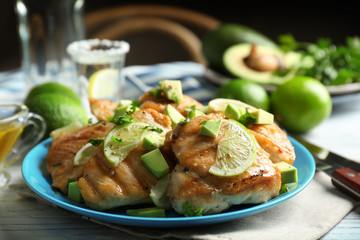 Plate of delicious tequila lime chicken on table