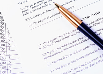 Business process - pen lying on the contract.